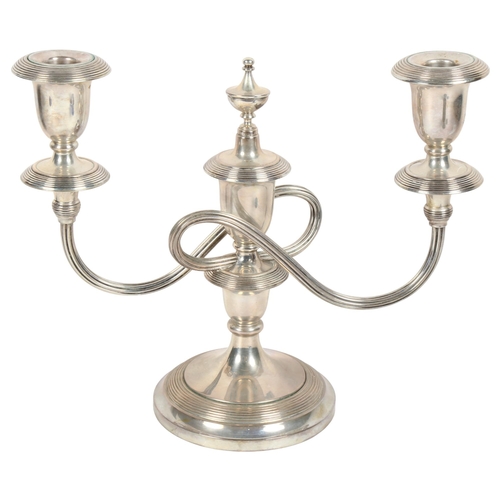 988 - A Continental silver (impressed 800) 2-branch table candelabra, height 22cm, 20oz