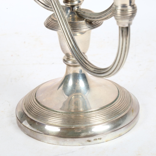 988 - A Continental silver (impressed 800) 2-branch table candelabra, height 22cm, 20oz