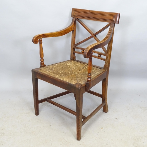 2715 - An early 19th century provincial armchair with rush seat