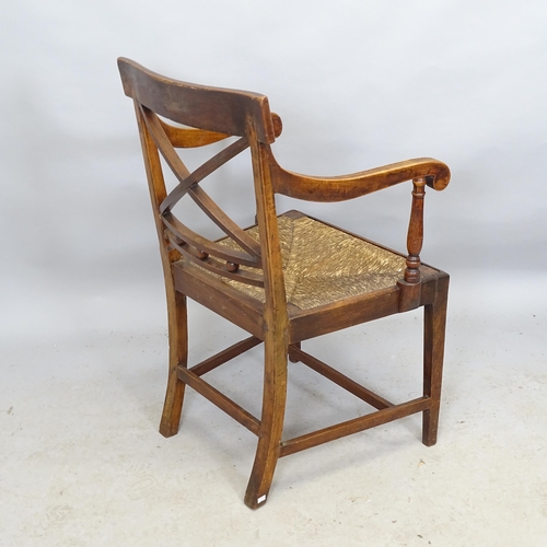 2715 - An early 19th century provincial armchair with rush seat