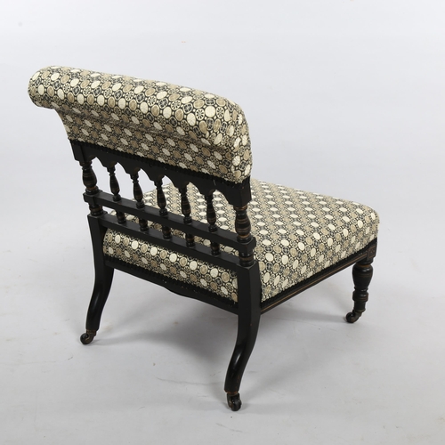 2354 - A Victorian Aesthetic Movement nursing chair, ebonised spindled frame recently re-upholstered in Jap... 