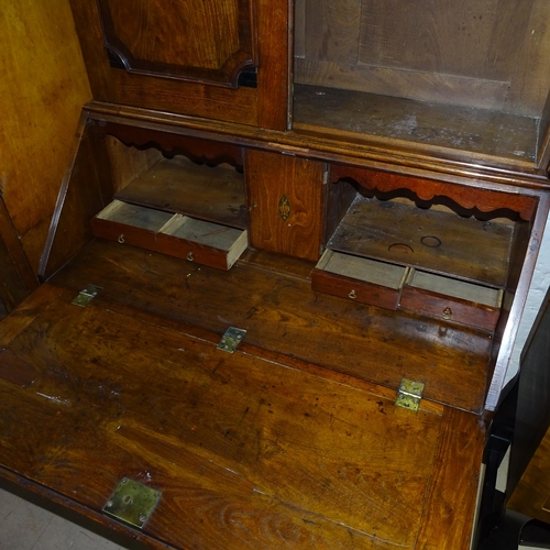 2045 - A 18th century oak 3-section bureau bookcase, the fall-front revealing a fitted interior with 4 long... 