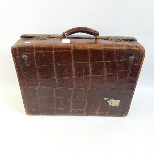 641 - A crocodile skin suitcase, length 50cm