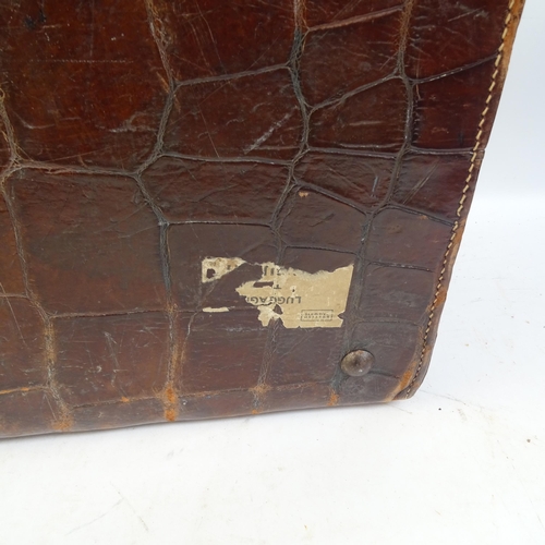 641 - A crocodile skin suitcase, length 50cm