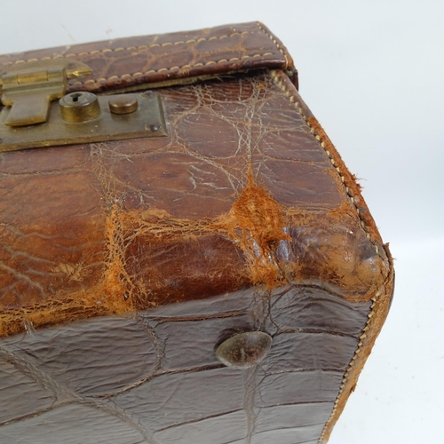 641 - A crocodile skin suitcase, length 50cm