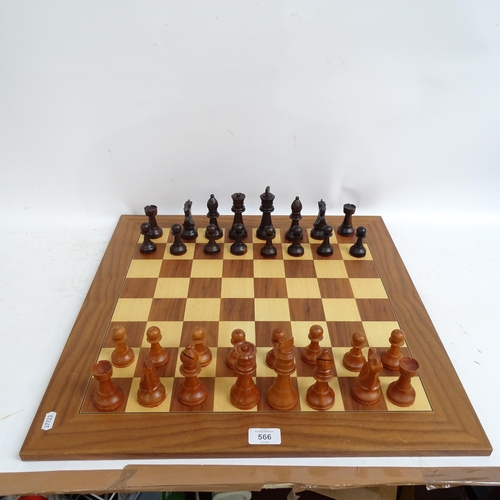 566 - A modern turned wood chess set, complete with 32 pieces and chess board, King height 11cm