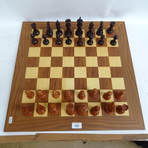 566 - A modern turned wood chess set, complete with 32 pieces and chess board, King height 11cm