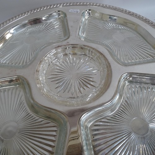 938 - A pair of silver plated lazy Susan's, with fitted glass dishes