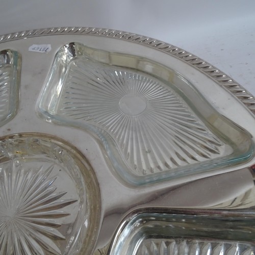 938 - A pair of silver plated lazy Susan's, with fitted glass dishes