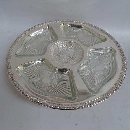 938 - A pair of silver plated lazy Susan's, with fitted glass dishes