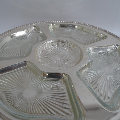 938 - A pair of silver plated lazy Susan's, with fitted glass dishes