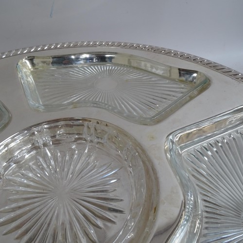 938 - A pair of silver plated lazy Susan's, with fitted glass dishes