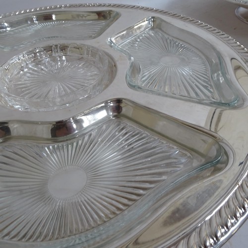 938 - A pair of silver plated lazy Susan's, with fitted glass dishes