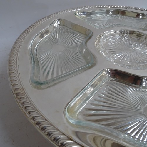 938 - A pair of silver plated lazy Susan's, with fitted glass dishes