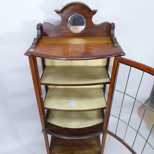 2002 - An early 20th century mahogany and satinwood strung display cabinet with raised mirror back and sing... 