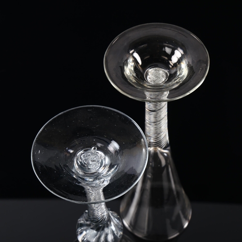 10 - An Antique funnel-shaped glass with air twist stem and domed base, height 21cm, and a thistle-shaped... 