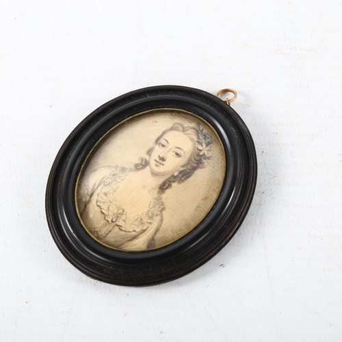 100 - An 18th century miniature watercolour on paper, half length portrait of a lady, unsigned in moulded ... 