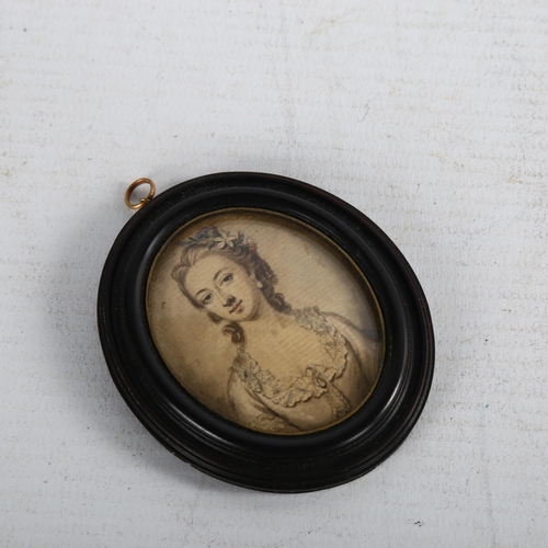 100 - An 18th century miniature watercolour on paper, half length portrait of a lady, unsigned in moulded ... 