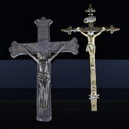 129 - An onyx and gilt-metal religious plaque, height 20cm, and 2 brass and spelter crucifixes (3)