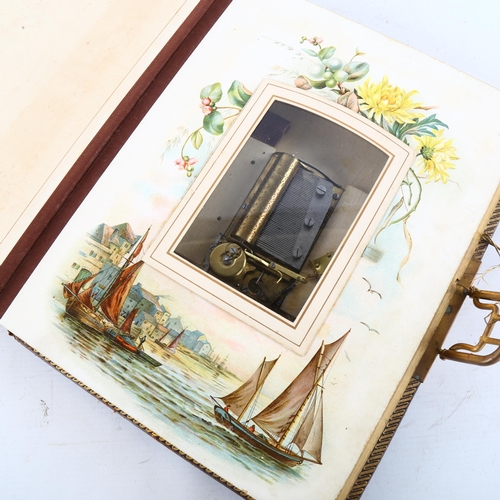 134 - A Victorian gilded leather-bound photograph album, with musical movement, 30cm x 23cm