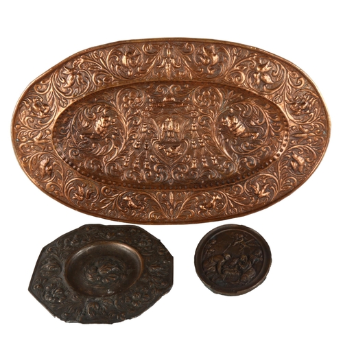 140 - An oval copper armorial plaque, length 52cm, and 2 relief cast bronze plaques (3)