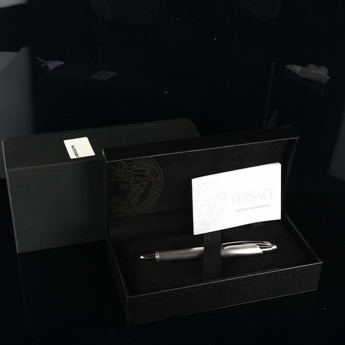 142 - VERSACE - a fine fibre tip pen, brushed and polished chrome finish, original box papers and cloth