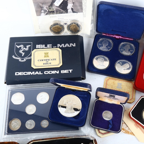 145 - *DESCRIPTION CHANGE*- Cased sets of commemorative crowns and other cased coins including a replica o... 