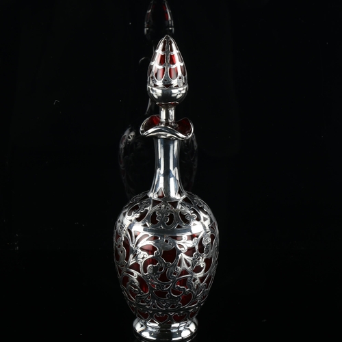 151 - A silver overlay cranberry glass decanter and stopper, height 22cm