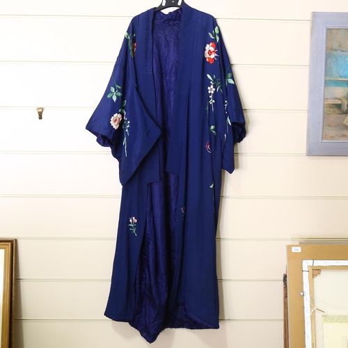22 - A Japanese dark blue silk Kimono with embroidered floral designs, early to mid-20th century