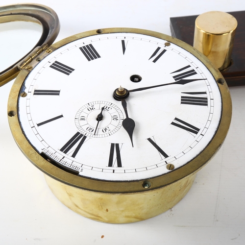 4 - An Antique brass ship's bulkhead clock, white enamel dial with Roman numeral hour markers and subsid... 