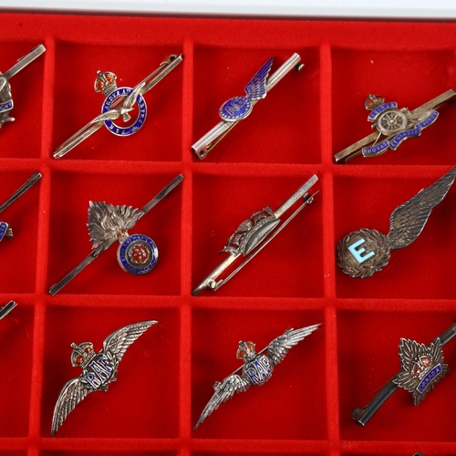 44 - A collection of 30 military sweetheart brooches, mostly WW II period, 27 marked silver