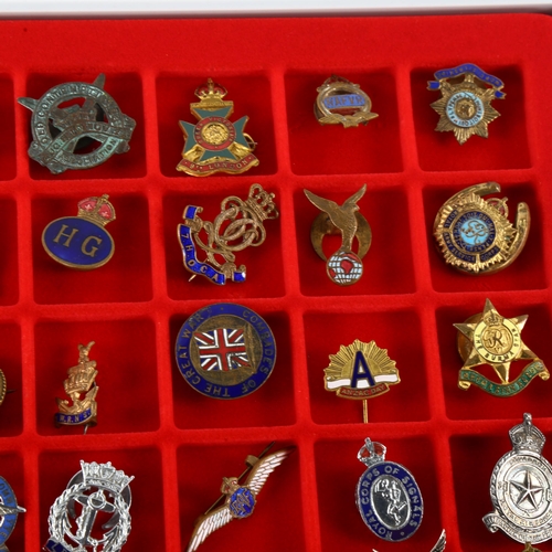 45 - A collection of 48 military badges and sweetheart brooches, some silver