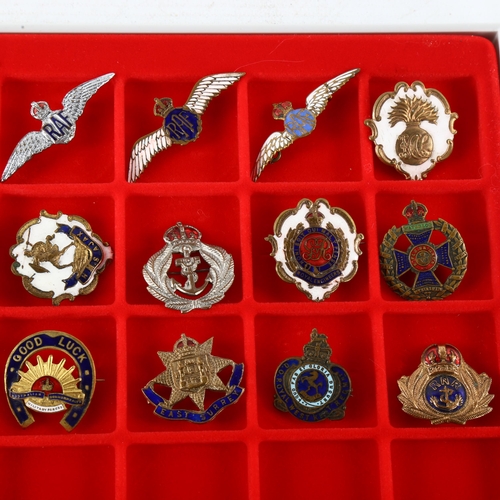 46 - A collection of 23 military badges and sweetheart brooches, WW I and II period
