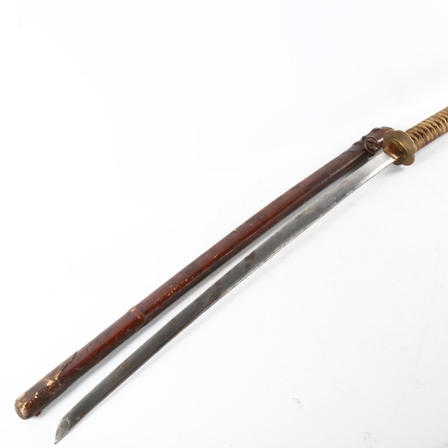 57 - A World War II period Japanese officers sword, with leather covered scabbard, length 106cm