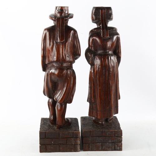 88 - A pair of 19th century carved and stained wood figures, height 44cm