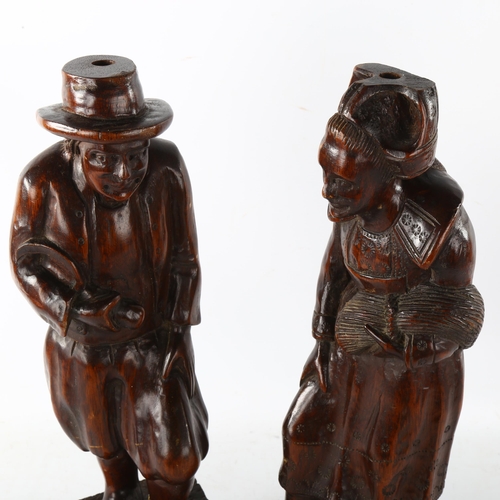 88 - A pair of 19th century carved and stained wood figures, height 44cm