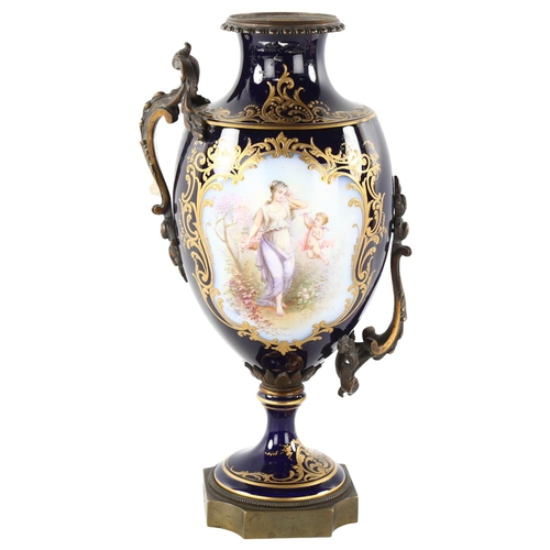 90 - **WITHDRAWN **- A French blue ground porcelain urn, with hand painted and gilded panels, and gilt-br... 