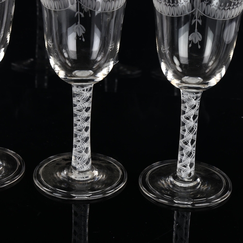 157 - A set of 4 wine glasses with engraved bowls and opaque milk twist stems, height 19.5cm