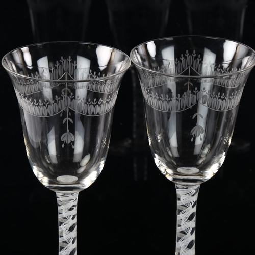 157 - A set of 4 wine glasses with engraved bowls and opaque milk twist stems, height 19.5cm