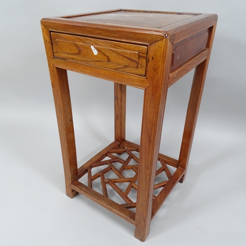 2006 - A Chinese elm square topped 2-tier jardiniere stand with single frieze drawer and geometric design l... 