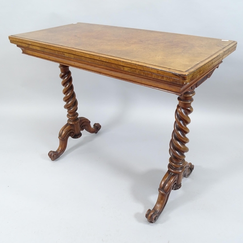 2011 - An antique burr walnut fold-over card table on barley twist legs. 92x76x45cm