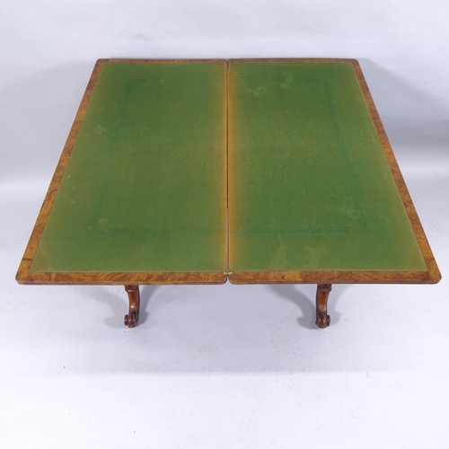 2011 - An antique burr walnut fold-over card table on barley twist legs. 92x76x45cm