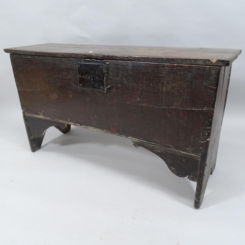 2026 - An antique oak blanket box, raised on stile legs. 112x63x34cm