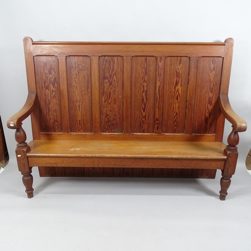 2028 - A panelled pine high back settle. 186x138x50cm.