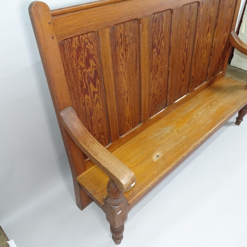 2028 - A panelled pine high back settle. 186x138x50cm.