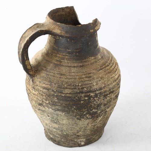 55 - A Rheinland high fired ceramic jug, circa 14th century, height 23cm