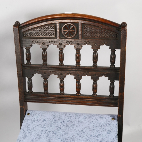 109 - A late Victorian Aesthetic movement folding oak chair by Bruce J Talbert, height 78cm