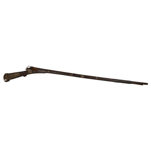 164 - A 19th century Indian Taradar matchlock rifle, length 142cm