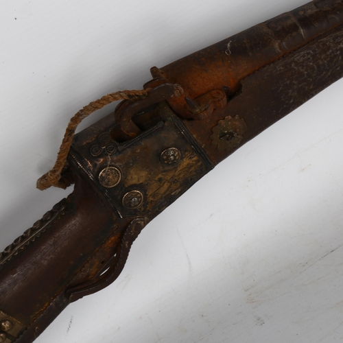 164 - A 19th century Indian Taradar matchlock rifle, length 142cm