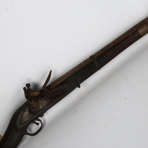 165 - An 18th/19th century Indian Taradar flintlock rifle, length 173cm